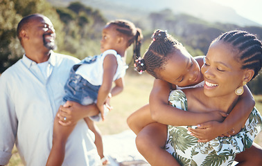 Image showing Happy, picnic and care with black family at park for fun, summer and relax together enjoying their holiday vacation. Happiness, youth and bond with mother, father and children in outdoors