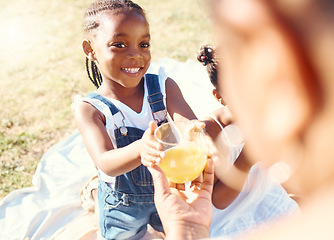Image showing Happy girl, juice and smile in family picnic fun and joy in happiness on a warm summer day in nature. Black child smiling for fresh cold healthy beverage in the hot outdoors with parent and sibling