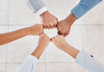 Image showing Diversity, team building and business people with their fist together to show teamwork, motivation and support. World, partnership and hands in a circle to show solidarity, mission and goals top view