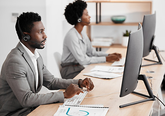 Image showing Call center worker in communication with people on internet online with computer at work, customer care help and support consulting at crm company. African telemarketing employee working in office