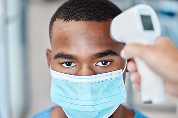 Image showing Covid thermometer test of man with face mask for office, work or business policy. Corona virus forehead scan or screening temperature at entrance for safety, precaution and protection in workplace