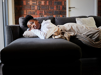 Image showing Sad, depression and stress girl thinking on the couch in the living room. Black woman suffering from mental health, anxiety and depressed after relationship, personal problem or life crisis in home