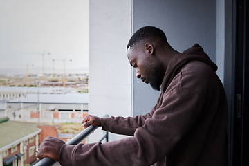 Image showing Depression, sad and mental health with a man feeling anxiety, angry or frustrated out on a balcony alone. Fail, depressed and problem with a young male in grief or fear and having a difficult problem