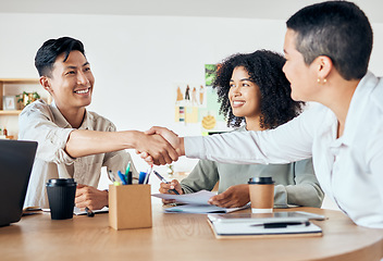 Image showing Handshake, global partnership and office deal in business meeting with man and women for diversity support, trust or crm. Smile, happy and success creative teamwork in b2b collaboration in strategy