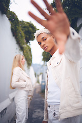 Image showing Fashion, model and gen z man from Guatemala in a alley outdoors pose for a luxury brand. Attractive, spanish and hip young millennial person with a serious, modern and cool look in a urban space