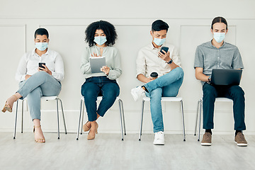 Image showing Business people with covid face mask and technology in line, communication on tablet, phone and laptop before interview and connection to global world. Employees with tech in recruitment at work
