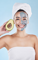 Image showing Avocado face mask for beauty skincare, food for skin health and product for nutrition diet against blue mockup studio background. Portrait of happy, healthy and Brazilian girl with cosmetic fruit