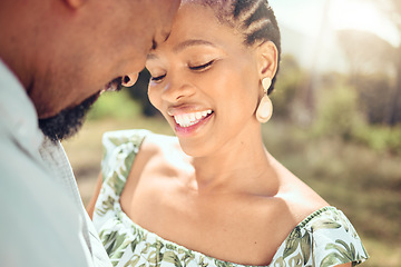Image showing Love, black couple and forehead touch in nature with a smile on holiday or date. Happy black man and woman, romantic African people or lovers bonding in affection together in the shining summer sun.