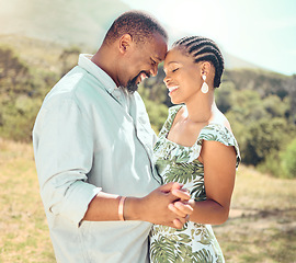 Image showing Black couple dancing in garden, park or nature together outdoors for love, relax and playful fun. African people, partners on a date and happy romantic marriage, intimate dance and care relationship