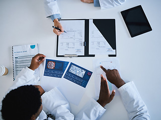 Image showing Doctor, research paper and finance planning in meeting, collaboration or teamwork strategy with science cure paper. Top view, hands or healthcare data for medical workers searching insurance funding