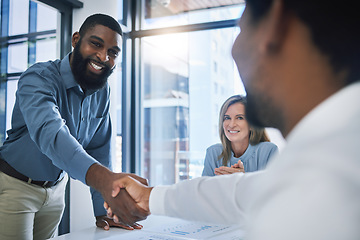 Image showing Deal, partnership and collaboration handshake of business people or men in b2b meeting at a diversity company. Happy smile of businessman shaking hands with hiring manager in a recruitment interview