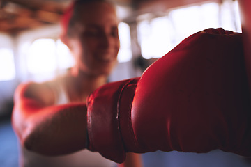 Image showing Boxing, fitness and sport with strong woman, boxing gloves to hit, punch and fight during training at a gym. Fit and athletic boxer female doing a workout during self defense exercise class