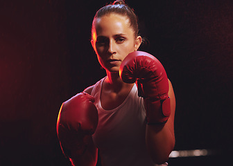 Image showing Fitness, boxer and woman in sports boxing gloves training, exercise and fighting to be a young champion fighter in the ring. Portrait, energy and strong girl with courage to power punch motivation