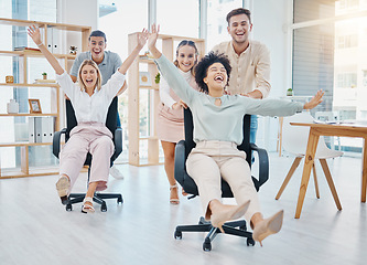 Image showing Happy business people doing office games with chair at work, celebration of success and freedom at startup company and crazy teamwork at job. Comic, smile and funny team doing teambuilding together