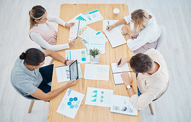 Image showing Marketing, advertising and team planning, strategy and paperwork above in a meeting at the office. Design teamwork in collaboration, analytics and business graphs, charts and data on paper documents.