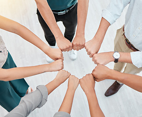 Image showing Teamwork, hands and collaboration with a team working together and standing in a huddle in the office. Solidarity, unity or trust and a group of staff with motivation and a goal for company success