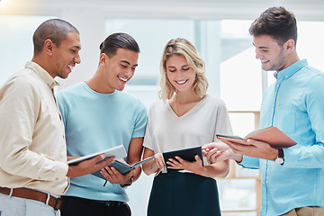 Image showing Journalist team collaboration in an office sharing notes and stories and planning strategy together at the workplace. Happy and excited business reporters working on a report for corporate news