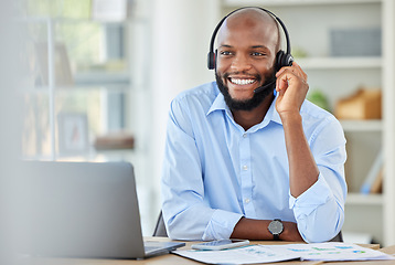 Image showing Black sales man, call center agent and customer service support advice, consulting and talking conversation loan in office. African, young and happy consultant, crm telemarketing and contact us work