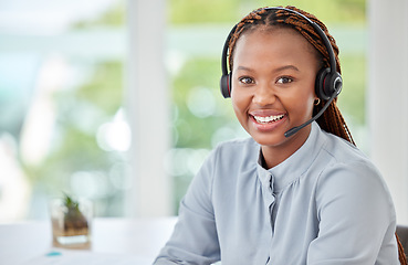 Image showing Portrait of a black customer support consultant, receptionist or call center agent with a headset. Happy, expert and professional woman employee working in ecommerce at a telemarketing company.