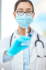 Image showing Covid vaccine, doctor with face mask and healthcare at hospital with nurse, medical injection for virus and help from expert at clinic. Portrait of worker in medicine helping with health at work