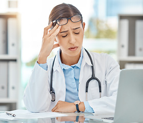 Image showing Headache pain, tired doctor and burnout stress from working in a medical hospital, problem consulting online with laptop and anxiety from healthcare work. Sad nurse thinking of consultation in office
