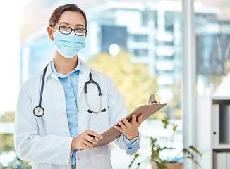 Image showing Medical doctor, covid hospital office and healthcare worker with face mask. Consulting clinical medicine advice, corona virus results on clipboard and nurse working in professional protection.