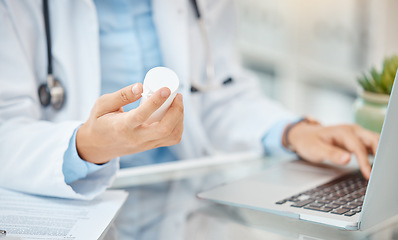 Image showing Pharmacist or doctor with prescription medicine bottle and laptop working on pills medical healthcare research. Hands of man cardiologist or professional pharmacy expert typing in antibiotics results