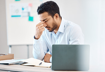 Image showing Tired, headache and eye strain from laptop with businessman while writing in notebook in corporate company. Stress, burnout and fatigue with young professional male at desk in office building