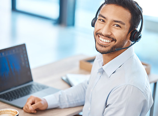 Image showing Asian call center man with headset and laptop working for contact us support, telemarketing sales and consulting company. Corporate customer service help and business success agent employee in office