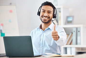 Image showing Thumbs up, call center and customer service with a man saying thank you and working in sales or telemarketing. Crm, contact us and consulting with a male consultant giving a yes gesture in an office