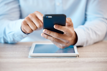 Image showing Internet, technology and communication, a man with phone in hand and tablet on desk. Businessman online in contact with client, reading email or browsing social media. Fintech, ux and payment via app