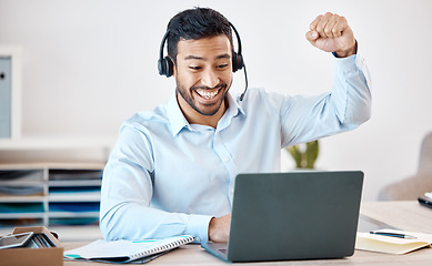 Image showing Success, customer service and winner with call center employee working on laptop in customer support, telemarketing or marketing. Celebration, consulting and communication with young man