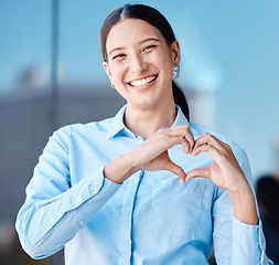 Image showing Hands, heart sign and business woman with smile, affection or love emoji. Portrait of happy corporate female, romance or hand symbol or emotion shape, intimacy or adoration, support or affection.