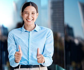 Image showing Thumbs up, hands and success with a business woman saying thank you, yes and happy to be a winner. Motivation, goal and target with a young female making a gesture in agreement or satisfaction