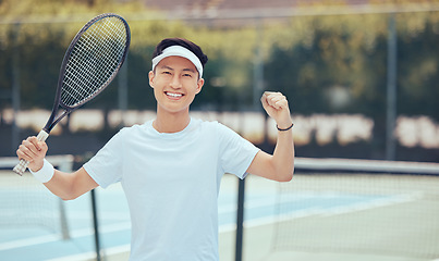 Image showing Success, tennis court and winner portrait of man with excited fist after athletic match. Victory, achievement and celebration of asian sports person with happy and satisfied expression.