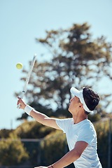 Image showing Professional tennis player man, fitness athlete and sports playing match, action and game with racket outdoors. Competitive, motivation and young focus guy serve, hit and practice healthy training