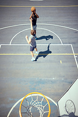 Image showing Basketball court players point score, team sports playing game and shooting in net with aim to win competition, match and action as community friends. Fitness skills, above and training outdoors