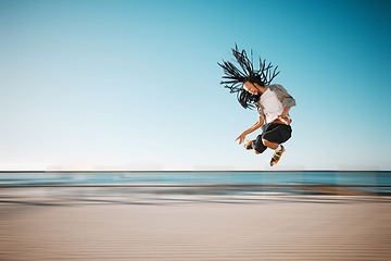 Image showing Sport, fitness and freedom man roller skates with speed and jump in blurred motion exercise, training and workout at beach. Happy, sports and healthy energy with action, free and health retro skating