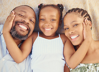 Image showing Love, care and happy black family bonding, relax and rest together at home from above. Portrait of smile parents enjoying time with their child, showing affection and being loving with their daughter