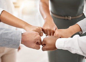 Image showing Diversity, business team and fist bump in office with support, team building and employee teamwork. About us, partnership and hands in circle with trust, mission and goals at work.