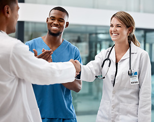 Image showing Handshake with doctors at a hospital, clinic or medical facility for good job, success or approval. Healthcare, health and thank you, shaking hands or clapping, congratulations or welcome onboard.