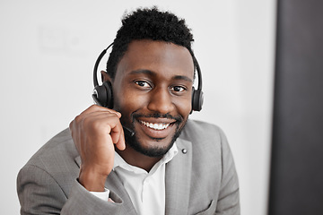 Image showing Call center, black man and contact us worker in crm customer service, consulting and sales telemarketing office. Happy smile portrait of businessman, receptionist or communication employee