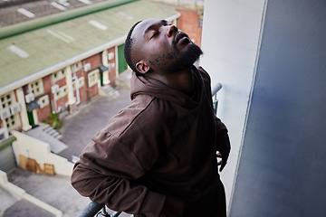 Image showing Depression, mental health and anxiety for sad man suffering from life problem stress on balcony of home apartment. Depressed black person face with negative mindset, pain and frustrated over failure