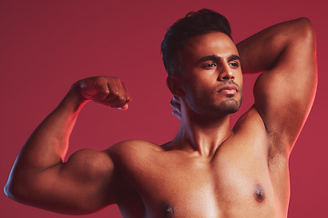 Image showing Fitness, health and nude man with muscle on a red studio background. Exercise, training and sports with a proud, strong and muscular weightlifting bodybuilder flexing his bicep after strength workout