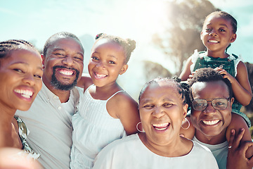 Image showing Portrait, happy black big family and love as they smile on vacation, trip or holiday. Ancestry, African people or grandparent, fathers and mother with kids together in the shining sun or sunshine.