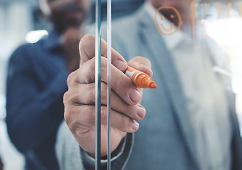 Image showing Project manager hand planning a strategy or writing notes on a glass. Businessman brainstorming and thinking of ideas in his presentation. Corporate male entrepreneur being innovative in an office