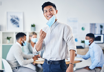 Image showing Portrait of happy Asian businessman with a mask for end of covid or coronavirus in an office meeting with team. Leader, ceo or manager with a smile for collaboration, teamwork or teamwork success