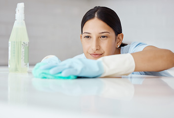 Image showing Cleaning, disinfect and housework with woman washing kitchen table with spray product to sanitize, clean and for hygiene. Housewife, cleaner or housekeeper with sanitary detergent and tidy apartment