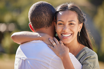 Image showing Love, happiness and a couple hug in a park together. Nature, sunshine and man and woman hugging on an outdoor date. Married life, romance and affection, happy lifestyle and loving smile on weekend.