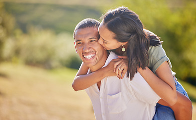 Image showing Love, date and outdoor couple in park playing on holiday, vacation or healthy lifestyle with green trees, bokeh and summer sun. Happy, wellness black people piggyback ride together or nature hiking